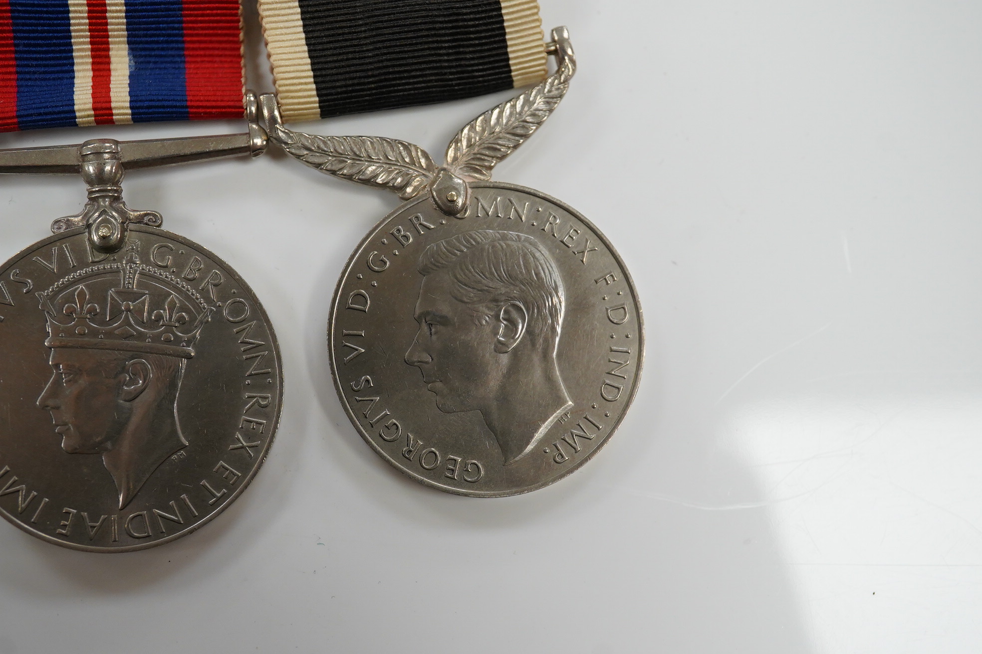 A New Zealand medal group, group of five medals including; The Service to New Zealand Medal 1939-1945, the Pacific star, the 1939 to 1945 star, etc. together with the cased miniature group. Condition - good